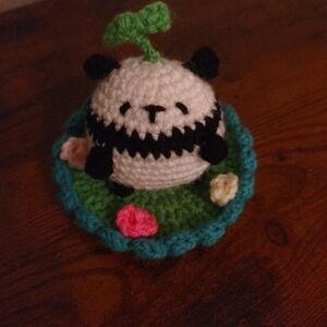 Crocheted Panda with Floral Lily Pad